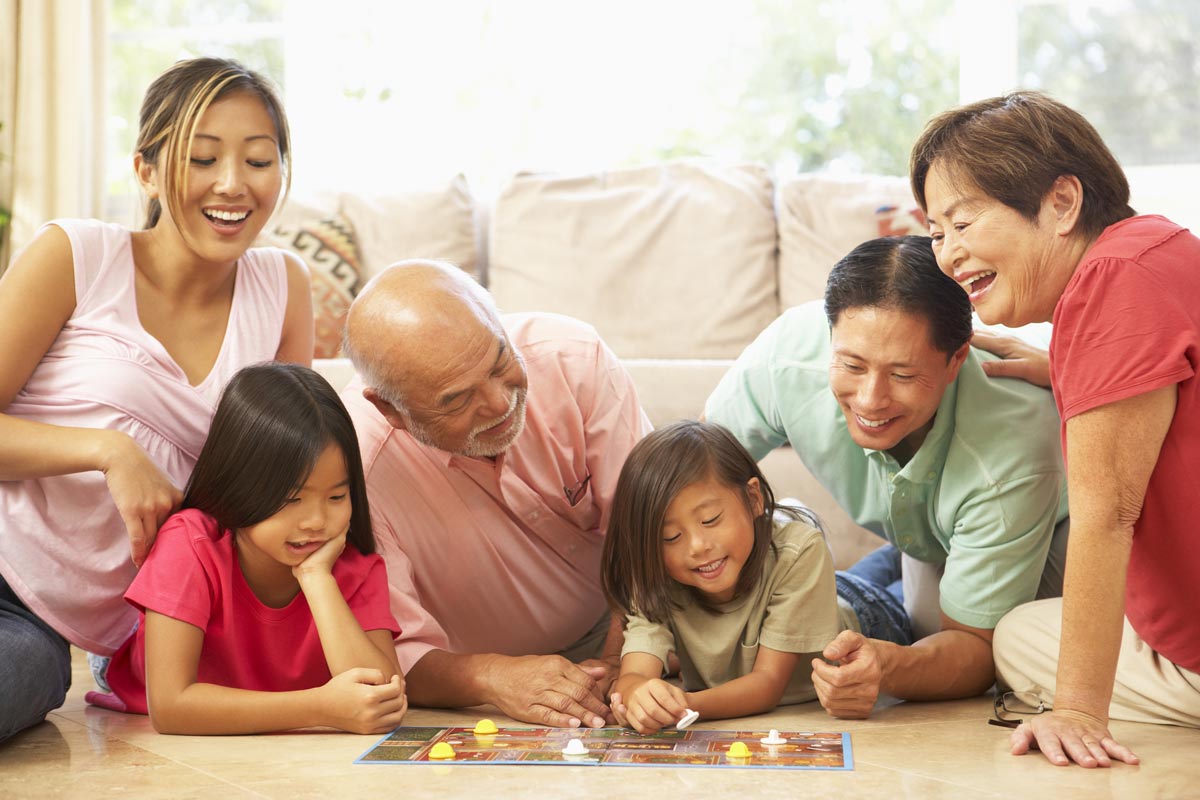 SoCo Village | Family playing board game