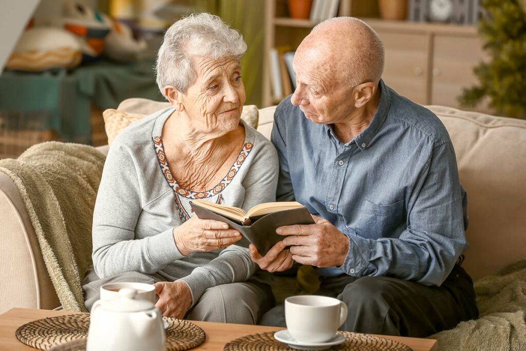 SoCo Village | Senior couple looking through.a book