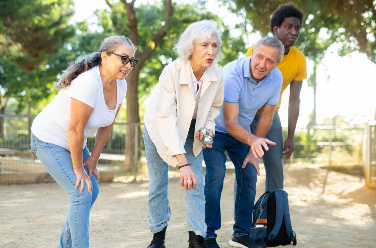 SoCo Village | Group of seniors playing a game outdoors