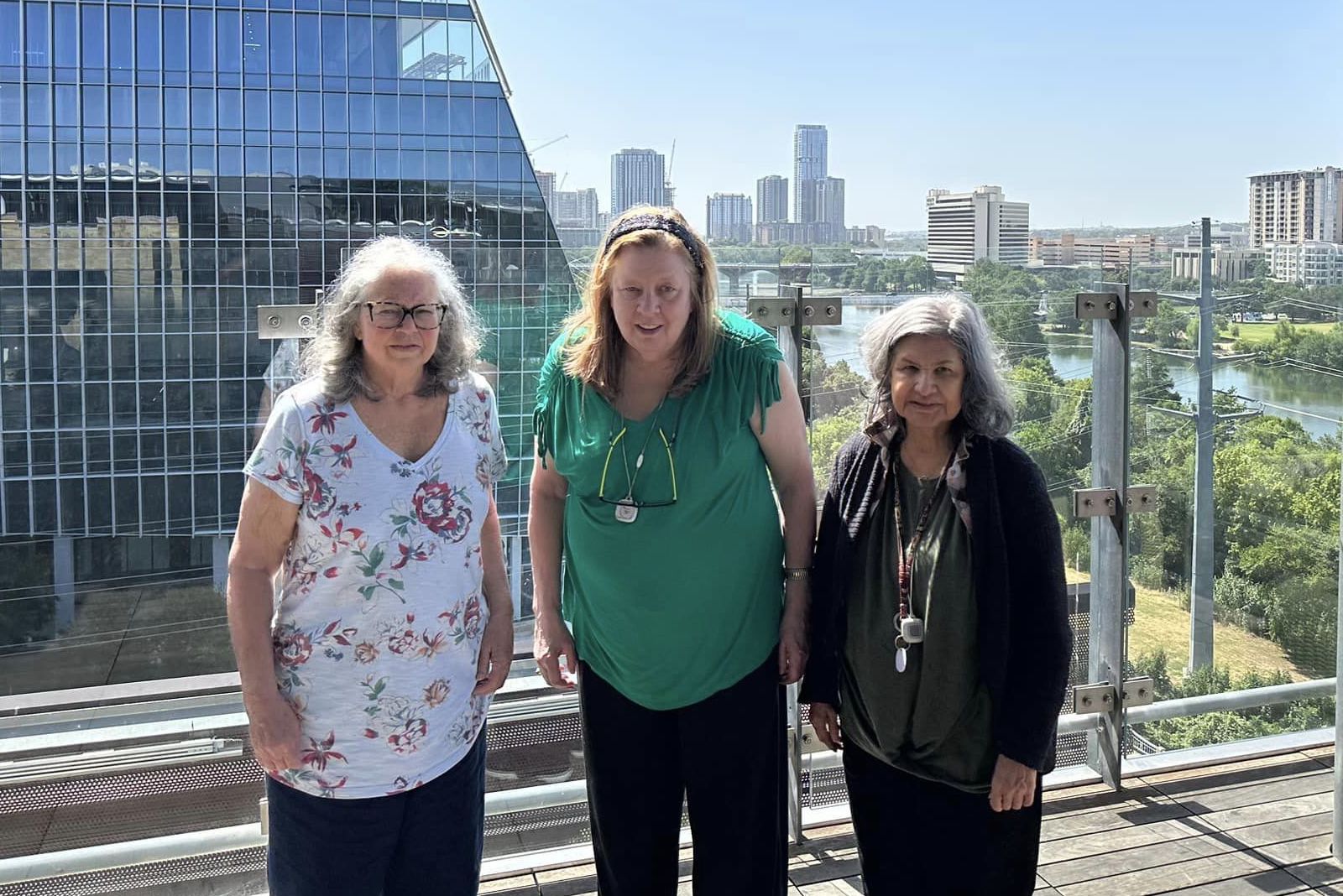 Soco Village | Seniors standing in front of the dowtown Austin skyline