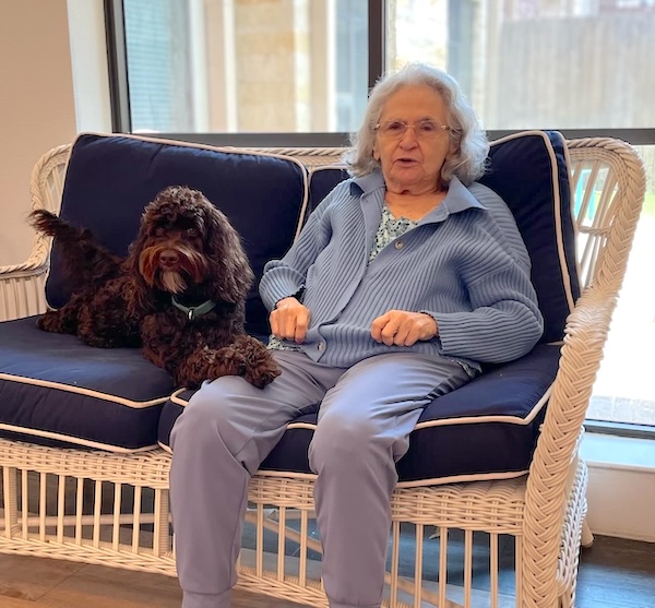 Soco Village | Resident sitting with Bruno